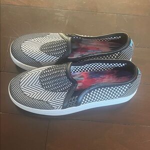 Black and White Skecher Street Memory Foam Slip-On Sneakers